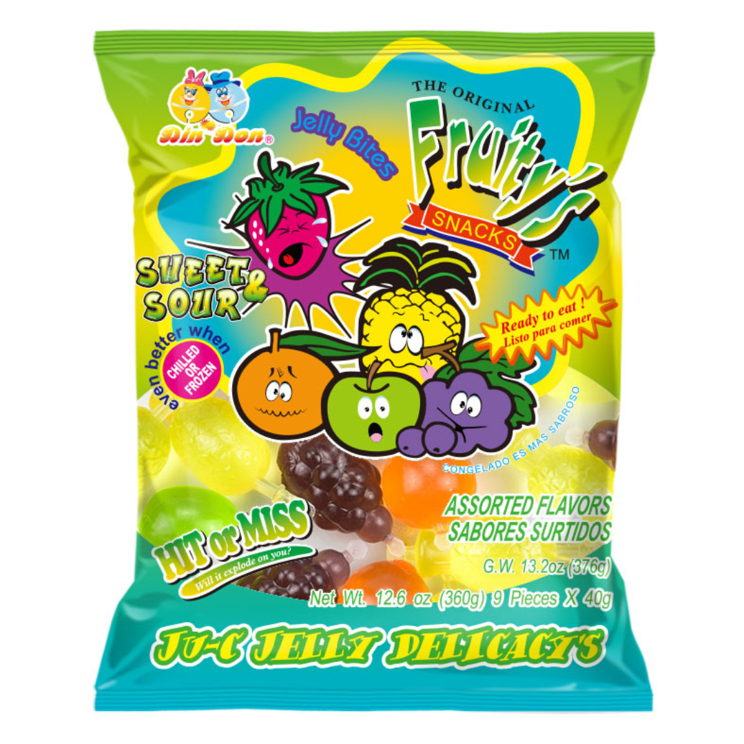 Green and teal 12.6 oz bag of Fruity's Sweet & Sour Jelly Bites by Din Don featuring 9 fruit-shaped jelly candy pieces in Strawberry, Pineapple, Orange, Green Apple, and Grape flavors with "Hit or Miss — Will it Explode on You?" branding.