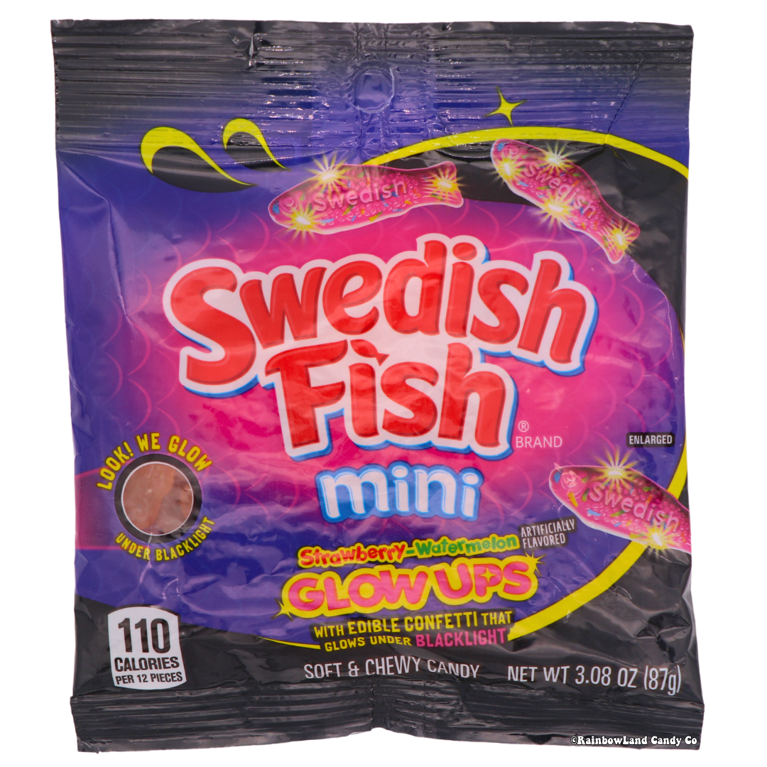 Swedish Fish Mini Glow Ups packaging with strawberry-watermelon flavored chewy candy, 3.08 oz, glows under blacklight.