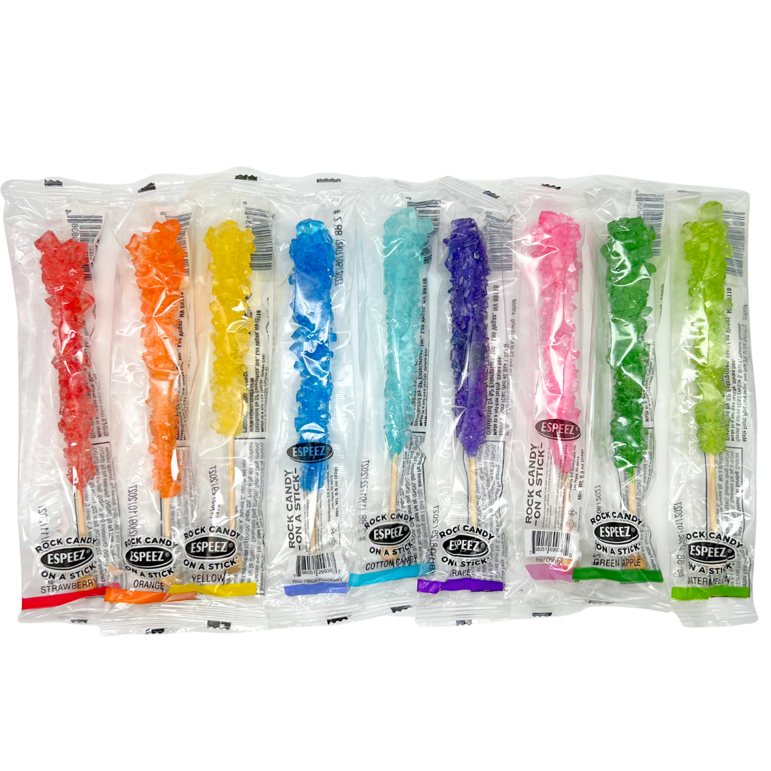 Rock candy sticks in assorted flavors including blue raspberry, strawberry, and grape.