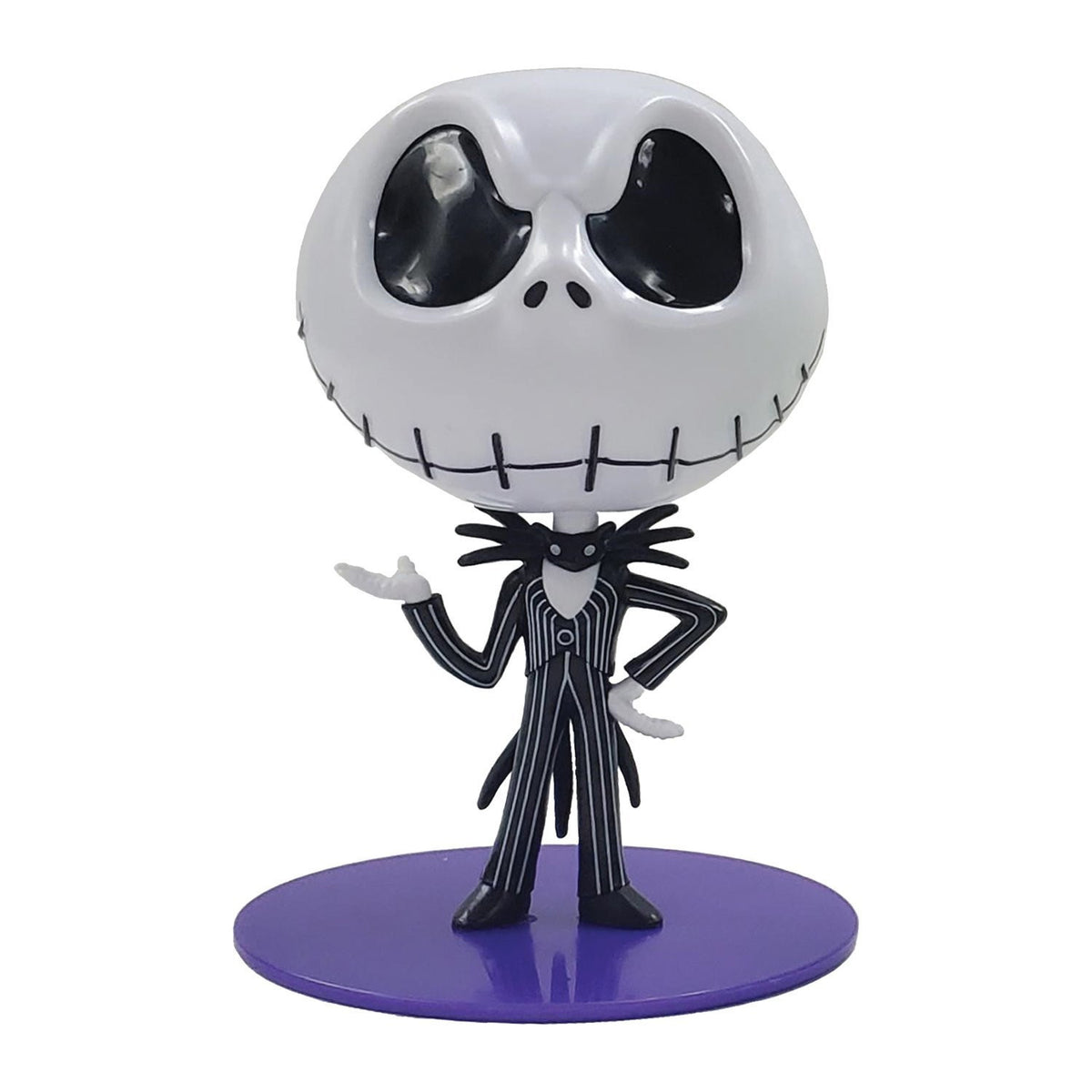 Jack Skellington collectible mini figure and candy case, white skull head with stitched grin, black and white pinstripe suit, standing on a purple display base.