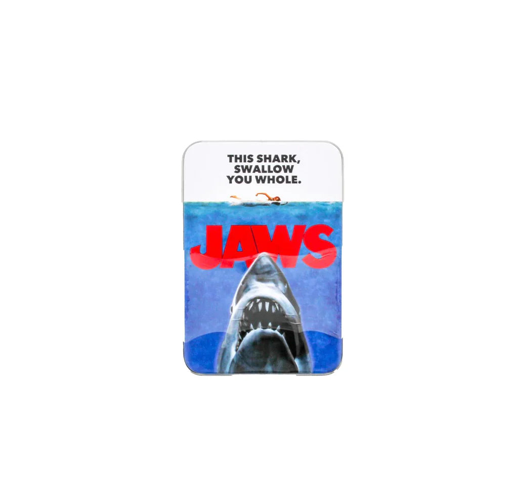 Jaws Shark Tooth candy tin with sour cherry flavored treats, featuring iconic 70s movie poster design.
