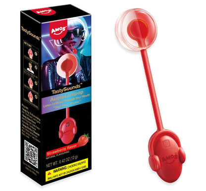 Amos TastySounds Strawberry AudioLollipop box next to the red headphone-shaped lollipop, showing the clear domed candy head and strawberry flavor label, net weight 0.42 oz.