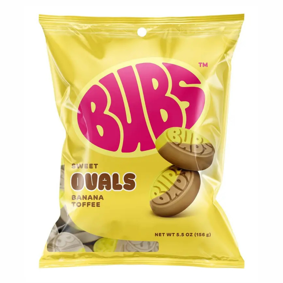 BUBS Sweet Ovals Banana Toffee bag, yellow packaging with a bold pink "BUBS" logo, showing two oval-shaped foam candies stamped with the BUBS name, net weight 5.5 oz.