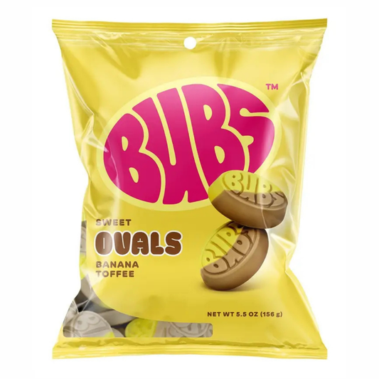 BUBS Sweet Ovals Banana Toffee bag, yellow packaging with a bold pink "BUBS" logo, showing two oval-shaped foam candies stamped with the BUBS name, net weight 5.5 oz.