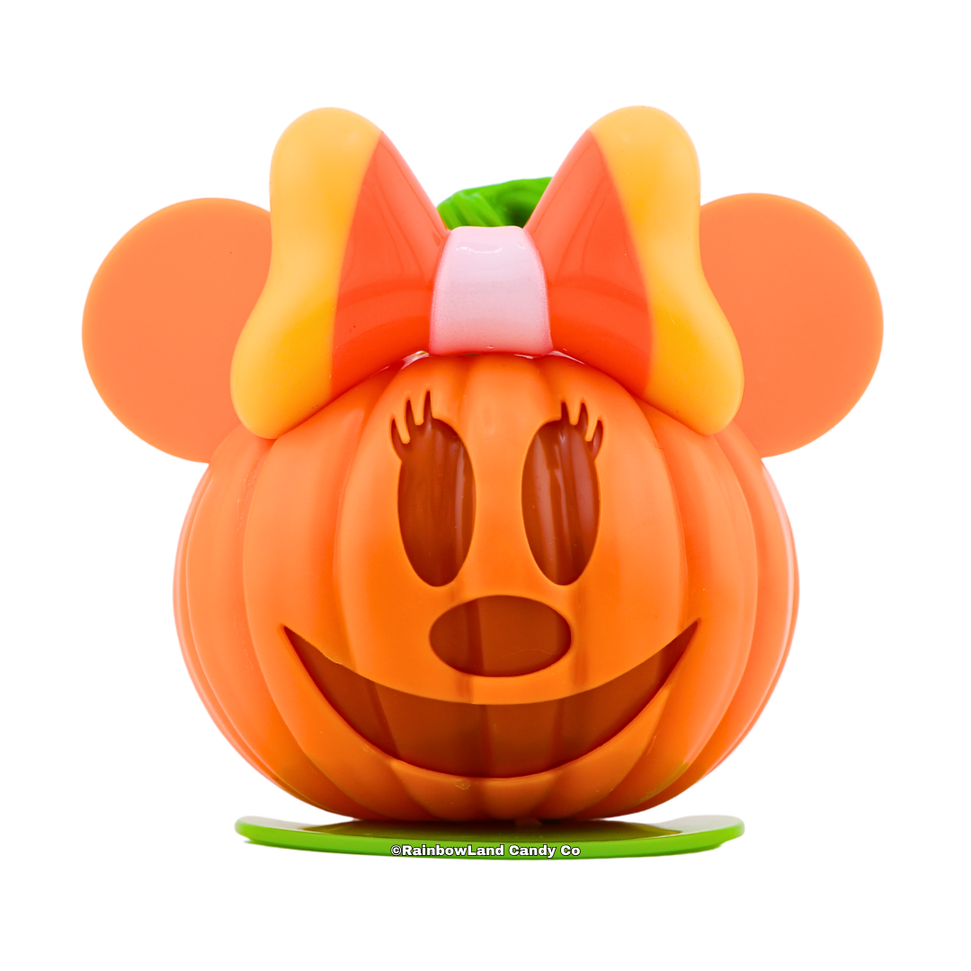 Disney Minnie Mouse Pumpkin Candy Character Case shaped like a jack-o'-lantern, featuring Minnie's ears and a candy corn themed orange, yellow, and white bow on top, net weight 0.35 oz.
