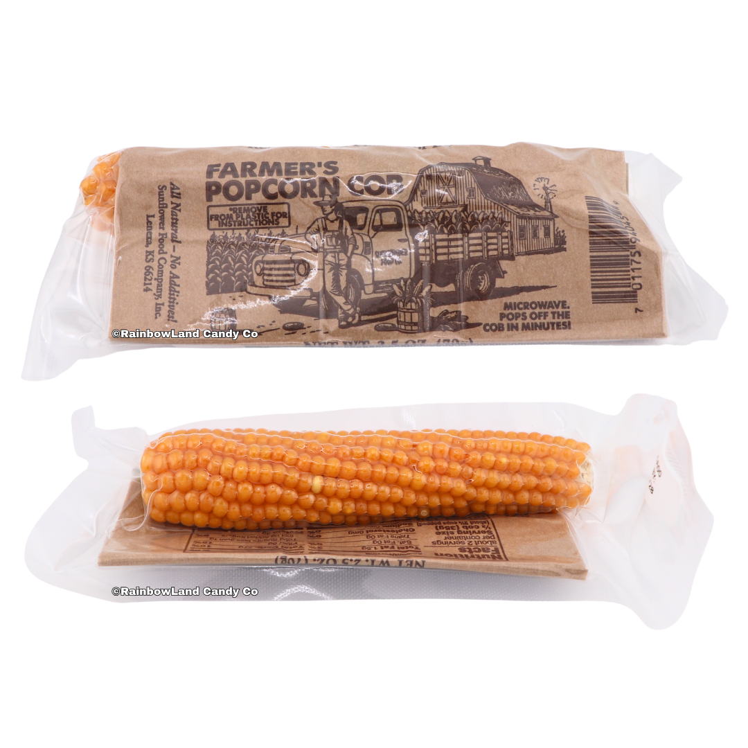 Farmer's Popcorn Cob package shown from both sides — the kraft paper farmer and barn design on top, and the visible corn cob on a clear plastic-wrapped bottom.