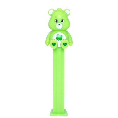 Green Good Luck Bear PEZ dispenser with a four-leaf clover belly badge, heart-shaped nose, and green candy stem.