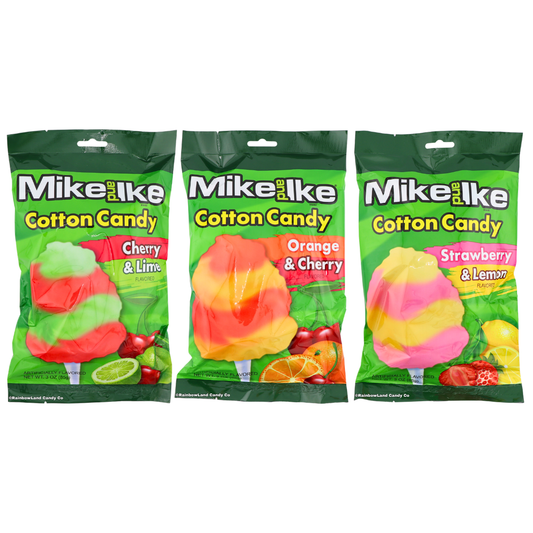 Three Mike and Ike Cotton Candy bags lined up together on a green pouch background, featuring Orange & Cherry, Strawberry & Lemon, and Cherry & Lime flavors, each with a swirled cotton candy pop graphic and matching fruit imagery.