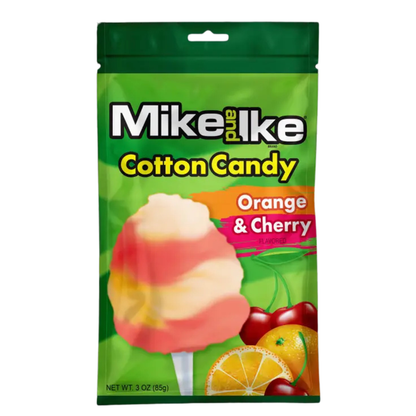 Mike and Ike Cotton Candy bag in Orange & Cherry flavor, featuring an orange and pink swirled cotton candy pop graphic on a green resealable pouch with orange slice and cherry fruit imagery, net wt. 3 oz.