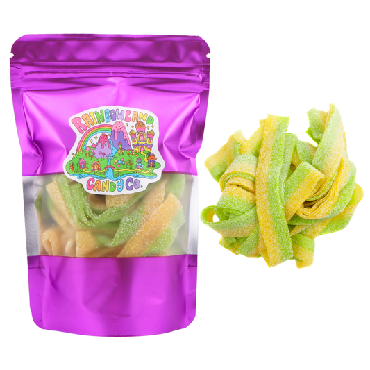 RainbowLand Candy Co. Sour Belts in a purple metallic resealable stand-up pouch with a clear window, shown beside a loose pile of green and yellow striped, sugar-coated sour candy belts.