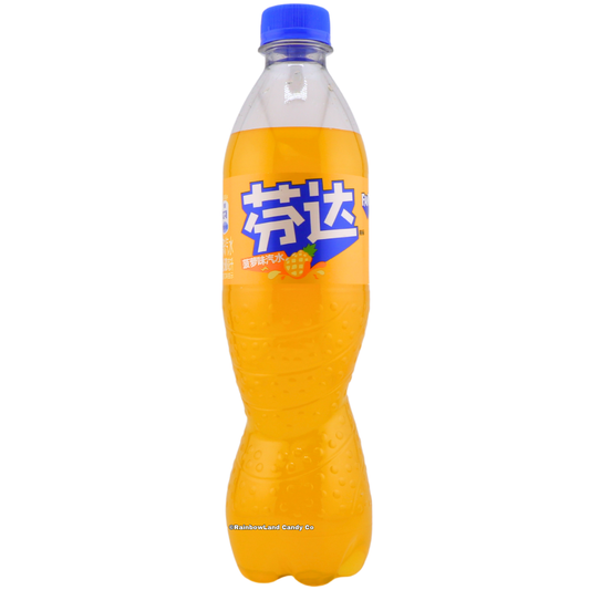 500 ml bottle of Fanta Pineapple imported from China featuring a yellow-orange pineapple-flavored soda with a blue cap and Chinese Fanta branding with pineapple graphics.