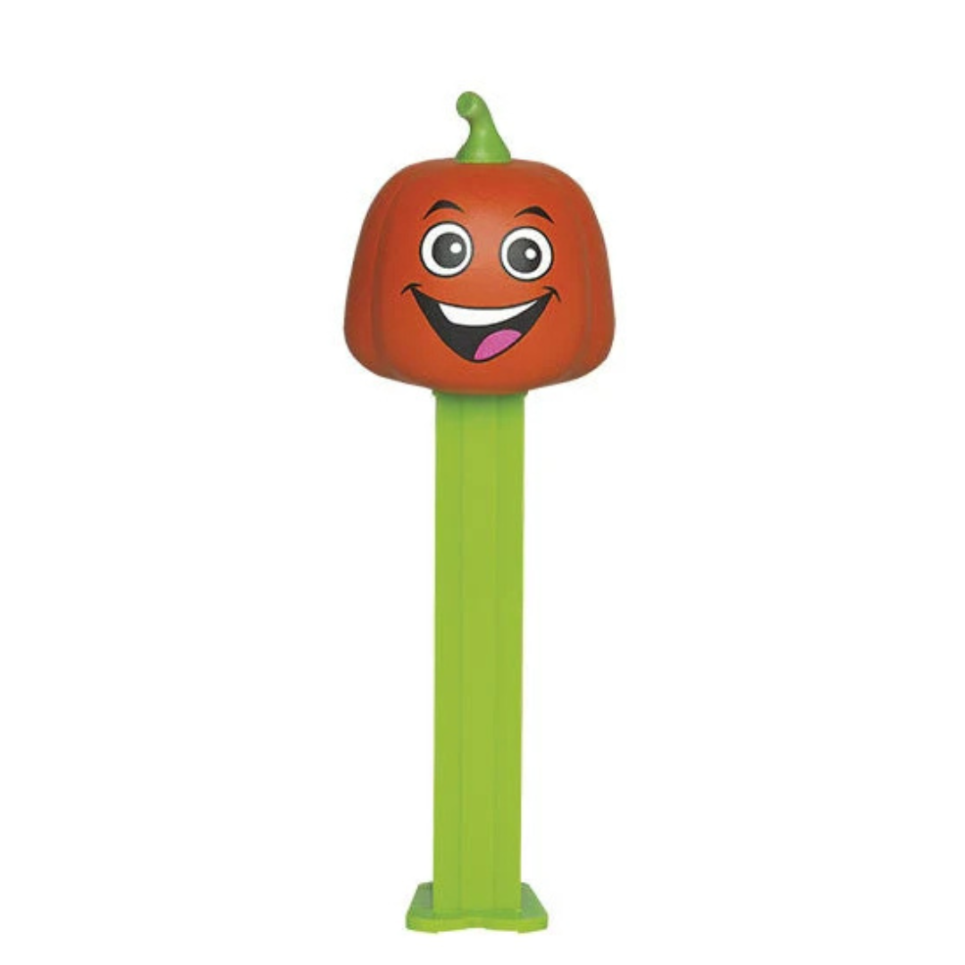Halloween PEZ dispenser with a smiling orange pumpkin face and green stem, green dispenser, sold by RainbowLand Candy Co.