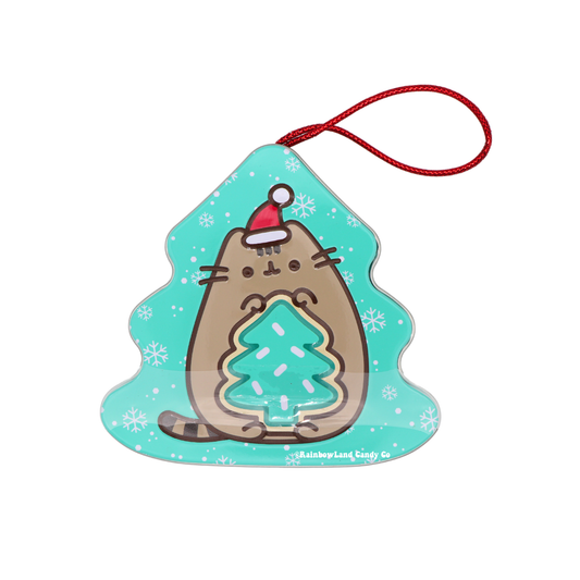 Pusheen Christmas candy tin shaped like a Christmas tree with sour green apple tree candy inside, showing Pusheen in a Santa hat hugging a sprinkle-covered candy tree, with a red string loop for hanging as an ornament.