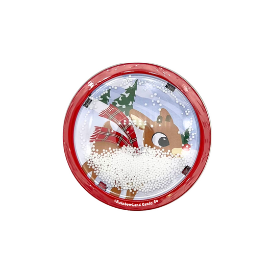Rudolph the Red-Nosed Reindeer holiday candy tin designed as a realistic snow globe, featuring a red rim, Rudolph wearing a red and green plaid scarf, snow-dusted pine trees, and white snow filling, containing sweet candy cane flavored candy.