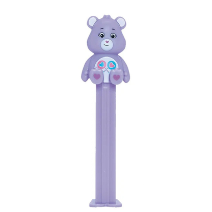 Purple Share Bear PEZ dispenser with two heart-shaped lollipops on its belly badge, heart-shaped nose, and purple candy stem.