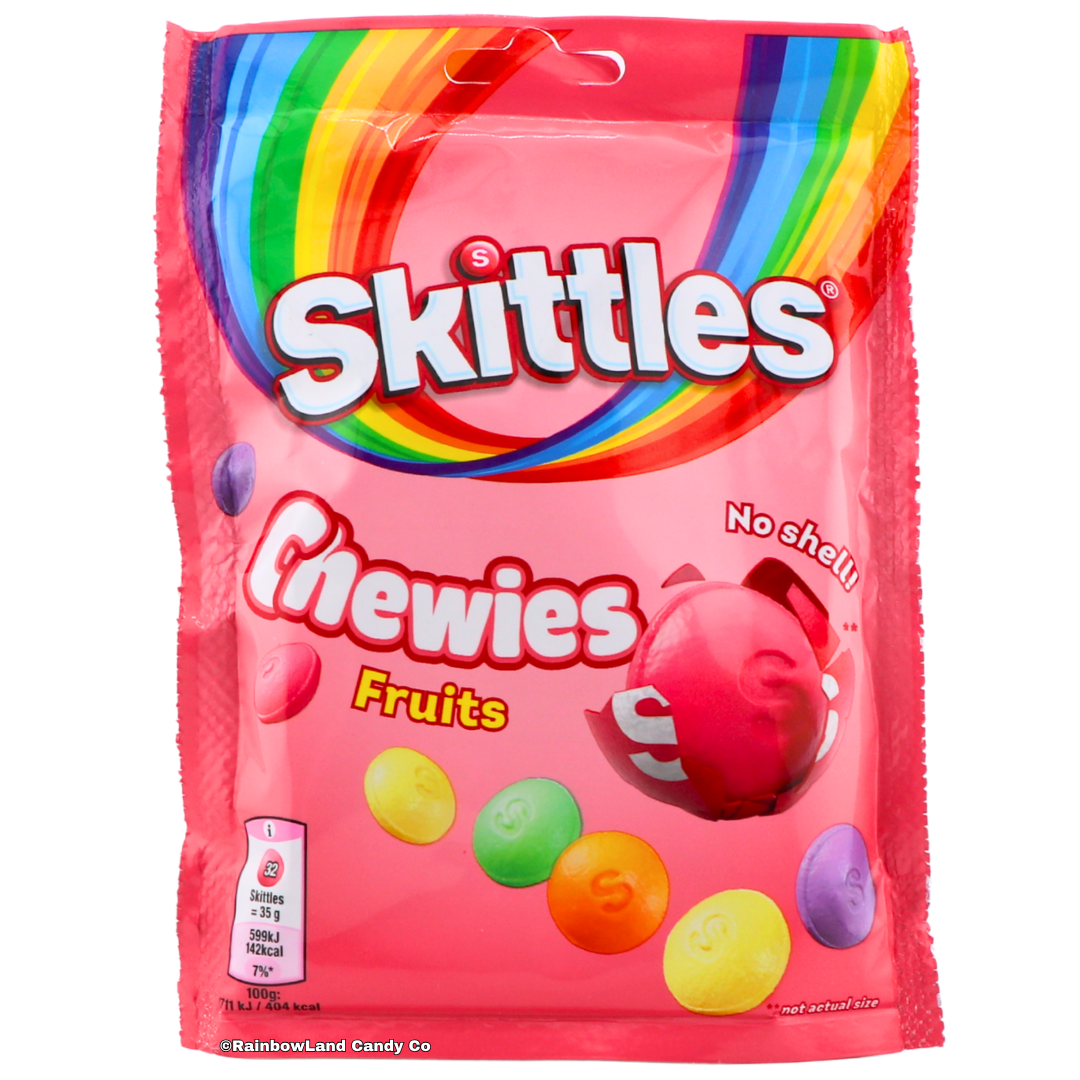 Pink 137g bag of Skittles Chewies Fruits imported from the UK featuring soft shell-free Skittles candy pieces in Blackcurrant, Lime, Lemon, Orange, and Strawberry flavors with a rainbow design and "No Shell" callout.