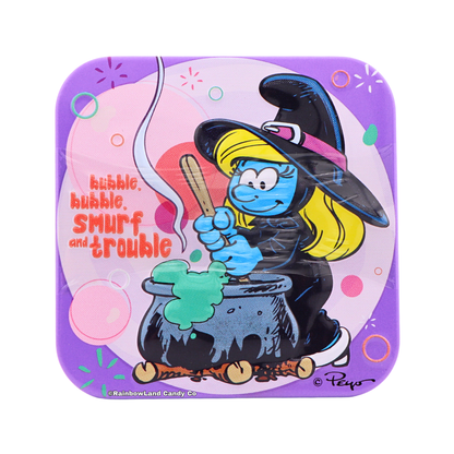 Purple Smurfs Halloween candy tin featuring Smurfette dressed as a witch stirring a bubbling green cauldron, with text reading "bubble, bubble, smurf and trouble."