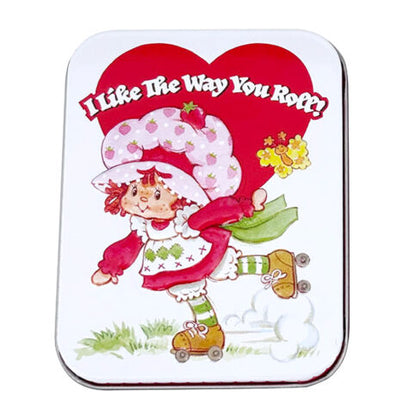 Reusable Strawberry Shortcake Valentine candy tin filled with strawberry-flavored candy hearts.