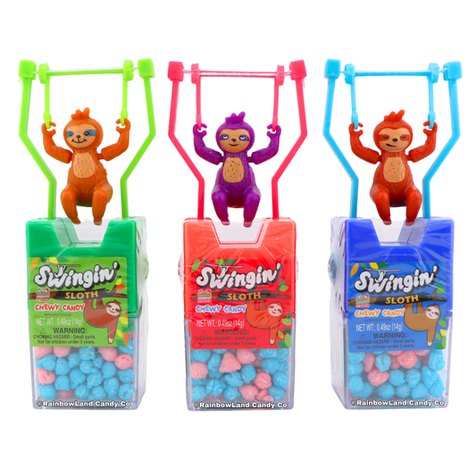 Swingin' Sloth Chewy Candy, three toy sloths in green, pink, and blue with side push buttons, perched atop candy boxes filled with pink and blue chewy candy pieces.