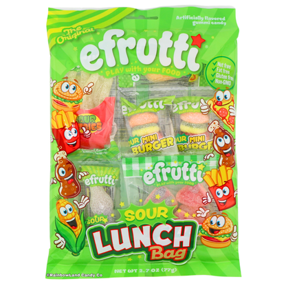 Efrutti Sour Gummi Lunch Bag packaging in bright green with cartoon food characters — a burger, fries, pizza, corn, and cola bottle — surrounding a red "SOUR LUNCH Bag" logo, showing individually wrapped sour gummi mini burgers and cola bottle pieces through clear windows, 2.7 oz assorted gummy candy.