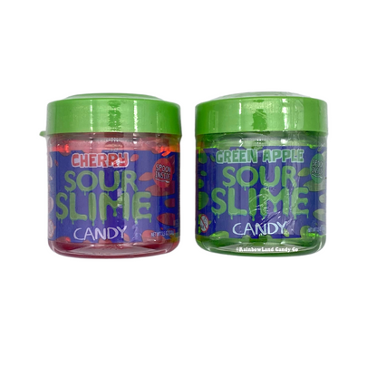 Sour Slime Candy 3.5oz jars in both available flavors — cherry in red and green apple in green — side by side, each containing thick scoopable sour gel candy with a spoon included inside.